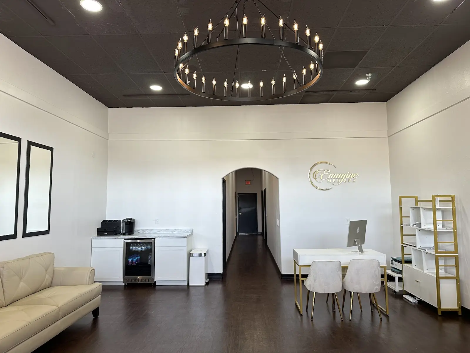 Emagine Med Spa lobby in Mira Mesa with a chandelier and the gold Emagine logo